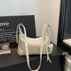 Bolsa transfronteiriça de alta qualidade com padrão trançado para mulheres, novo modelo 2026, versátil para o dia a dia, bolsa de ombro única para usar sob o braço, bolsa estilo "dumpling"