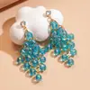 Aretes de aguja plateada con diamantes, borlas colgantes florales azules, diseño único y exagerado, aretes de nicho de lujo ligero para mujer