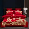 Juego de ropa de cama de lujo estilo chino, hecho de algodón 100% de fibra larga, un juego de cuatro piezas que incluye una sábana y una funda de edredón de algodón puro rojo, perfecto para la alcoba de una recién casada.