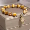 Pulsera Colgante de Buda de Piedra Ojo de Tigre Dorado Explosivo Diseño Retro Simple de Cadena Única Estilo Étnico para Novias