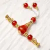 Ágata roja tres vías frotar línea dorada cuentas de barril viejo cuentas redondas Wen jugar accesorios DIY pulsera de mano con cuentas suministro al por mayor
