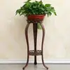 Soporte de flores de hierro forjado, estilo europeo, de pie, estante para macetas de interior de varios niveles para sala de estar y balcón, adecuado para plantas en maceta como plantas araña y plantas en maceta.