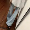 Jeans acampanados azul claro para mujer, nuevo estilo otoño 2026, adelgazantes, de cintura alta, modernos y favorecedores para figuras petite, no ajustados.
