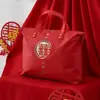 Bolsa de presente colcha de casamento conjunto de quatro peças bolsa de embalagem dote colcha feliz bolsa grande de armazenamento bolsa de tecido Oxford vermelha