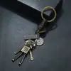 Decoración Creativa y Linda de Colgante de Robot Musical para Llavero de Coche de Hombre, Accesorio Versátil de Venta Caliente Transfronteriza