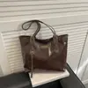 Bolsa de Ombro Grande Capacidade Moda Feminina 2025 Casual Nova Nicho para o Dia a Dia Bolsa de Mão Bolsa Tote Casual de Couro Patente