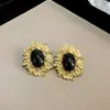 Pendientes geométricos redondos negros con pasador de plata chapado en oro real, pendientes de moda estilo europeo y americano, pendientes de lujo ligero de alta gama, venta al por mayor