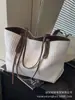 Bolsa de Gran Capacidad para Mujer 2025 Nuevo Otoño e Invierno Textura Bolso de Hombro de Gama Alta Estudiante Universitario Clase Trabajo Ropa Bolsa de Mano