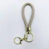 Venta al por mayor del fabricante Llavero de Cuerda de Aleación Tejida y Cuero Accesorios Colgantes Material PU Bolsas Pequeñas de Regalo Accesorios para Llaveros