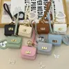 Mini bolsa de presente simples pode guardar fones de ouvido e chaveiros, bolsa de fone de ouvido de cor sólida, pingente de couro, bolsa quadrada criativa, bolsa longa