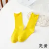 Calcetines de tubo medio blancos de primavera y otoño de la marea para niños, calcetines de algodón de color liso con términos verticales de verano para niñas jk, negros rizados apilados