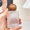 Botella dispensadora de perfume de alta gama 30 ml Marca grande Co Botella rociadora 50 ml Presión de vidrio portátil Botella vacía 100 ml