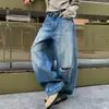 Jeans nuevos y elegantes para hombre con un diseño de alta gama desgastado, efecto adelgazante, versátiles, estilo nicho, pierna ancha, pantalones largos lavados