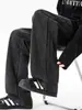 Pantalones deportivos casuales simples retro americanos, nuevo estilo primavera y otoño, holgados y versátiles, con un diseño de pierna recta ancha y caída.