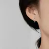 Pendientes de corazón calado con microincrustaciones de circonita, transfronterizos europeos y americanos, nuevo diseño de lujo ligero, pendientes de tornillo retorcido para mujer