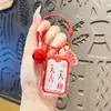 Tarjeta de texto de amuleto de la suerte creativo Ping An Xi le llavero acrílico colgante para mochila de pareja saludo pequeño regalo