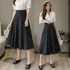 Saia midi de bolinhas feminina, novo estilo outono 2026, estilo Hong Kong, barra ampla, cobre o quadril, cintura alta, saia evasê, estilo de férias