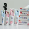 El puesto vende pasta de dientes efervescente sabor a fruta arándano maracuyá pasta de dientes pequeña fresca 110G180G venta al por mayor de fábrica