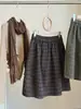 Falda corta de lana mezclada a cuadros de tamaño pequeño para mujer, nuevo estilo de otoño, estilo coreano, línea A, cintura alta, adelgazante, esponjosa, con forma de capullo, falda midi