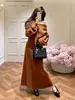 Conjunto de Punto Estilo Francés para Mujer Otoño/Invierno 2026 Nuevo Conjunto de Dos Piezas: Jersey de Canalé Asimétrico y Falda