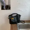 Bolso cubo de nicho vintage de alta gama para mujer, nuevo modelo 2026, bolso de hombro versátil y moderno para el día a día, bolso cruzado casual, moderno