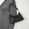Bolso tejido súper popular para mujer, nuevo estilo minimalista 2026 tipo bolsa de dumpling, bolso de axila exquisito y versátil, bolso cruzado único