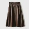 Elegante y versátil falda de cuero de cintura alta, elegante media falda, moda femenina otoño 2026, falda adelgazante de PU ecológica