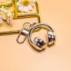 Nuevo llavero creativo de auriculares 3D, un accesorio moderno y genial para bolsos, joyería hecha a mano para manualidades y materiales para accesorios, al por mayor