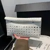 Comércio exterior transfronteiriço estilo coreano grande capacidade vazado 2026 novo superfície macia casual simples cor sólida clutch envelope bolsa feminina