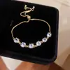 Pulsera tipo jaladera con colgante redondo de circón de colores, pulsera de lujo ligero, sensación de alta gama, pulsera de temperamento lujoso, pulsera versátil, venta al por mayor
