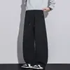Calça casual masculina, nova coleção outono/inverno 2026, estilo americano, com caimento fluido, cordão, design reto retrô e um tecido de malha moderno e estiloso