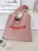 46203 Bolso de hombro tipo tote rosa claro con estampado de letras estilo coreano, bolsa de lona de gran capacidad para estudiantes y para ir al trabajo, bolso de lona versátil