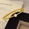 Cuentas redondas doradas simple versátil temperamento con cuentas pulsera en capas pulsera joyería de mano artículo popular de transmisión en vivo lujo ligero diseño exquisito