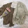Abrigo corto holgado y ligero de verano 2025, ajuste slim, cárdigan de punto de manga larga, camisa de aire acondicionado, chal para mujer, algodón blanco