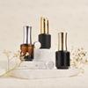 Fábrica en stock, venta directa, botella de vidrio cosmético, 15 ml, pegamento para esmalte de uñas negro, botella de esmalte de uñas a prueba de luz, oferta especial, botella de pegamento para esmalte de uñas