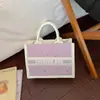 Bolsa feminina de nicho de alta qualidade, nova bolsa de mão com laço da moda de verão 2026, bolsa tote color block de bolinhas