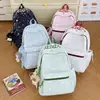 Nuevo modelo 2026 mochila casual estampada estilo ins para estudiantes de secundaria y primaria, mochila ligera de gran capacidad para ir a la escuela para niñas