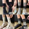 Calcetines de rayas gruesas de edición limitada de primavera para mujer, lindos y versátiles, con diseño de cachorro de dibujos animados, creando una atmósfera elegante, calcetines JK populares