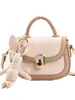 Bolso bandolera pequeño con textura de moda para mujer, primavera y verano 2024, nuevo bolso de hombro combinable, estilo occidental, bolso de sillín portátil