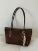Nueva colección de primavera 2026: Bolso de mano para mujer estilo coreano, con un elegante diseño color block, gran capacidad y correa para el hombro, lo que lo convierte en un bolso tote versátil para ventas transfronterizas.