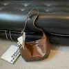 Bolsa retrô de nicho para o dia a dia Shuai Mi Jia para mulheres, nova moda outono 2026, bolsa de ombro e transversal estilosa de grande capacidade