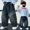 Ropa infantil pantalones de niño otoño 2026 nuevo estilo pantalones cargo de mezclilla para primavera y otoño para niños de mediana edad otoño casual pantalones largos