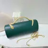 Nuevo bolso de noche de lujo ligero transfronterizo para mujer, bolso de mano cilíndrico de color liso con asa de serpiente para fiestas de cóctel y banquetes