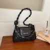 Bolsas populares de nicho de varios años para mujer otoño 2026 nuevo estilo bolso cruzado texturizado bolso de mano bolso de hombro único para debajo del brazo
