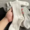 Meias de tubo longo com massageador na sola, meias de tubo alto para outono e inverno, esportes, basquete, corrida, resistentes a odores, meias de tubo médio, cor sólida, respiráveis