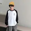 Camiseta de Manga Larga con Retazos de Moda para Niños Otoño 2026 Nueva Camisa Base Holgada para Niños Top Primavera y Otoño Venta al por Mayor