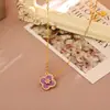 Conjunto de brinco e colar de zircônia cúbica de trevo de quatro folhas roxo, um acessório luxuoso e estiloso, versátil e adequado para o uso diário, disponível para dropshipping