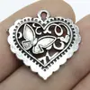 25x 24mm 2.1g Europa y Estados Unidos accesorios de joyería vintage populares colgante de corazón de amor mariposa de doble cara