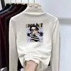 Otoño Invierno 2026 Camiseta Térmica de Felpa para Niña Cuello Medio Alto Manga Larga Capa Base Elegante Ropa Interior Cálida para Niños con Adorno de Volantes