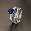 Anillo de banda cruzada europeo y americano Explosiones Diamante de Zirconia Montura de cuatro garras Diamante retorcido Anillo de banda simple Personalidad Anillo de estilo de lujo ligero